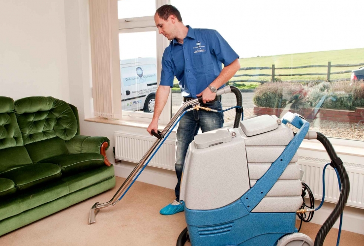 Our team member cleaning a carpet in Brighton